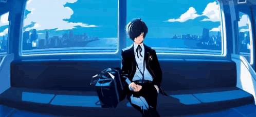 A Man In A Suit Is Sitting On A Bench In Front Of A Window With A View Of The Ocean . GIF