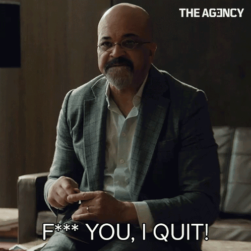A Man In A Suit Is Sitting On A Couch And Says " F ** You I Quit " GIF