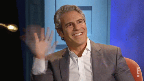Smiling Man In Suit Waving GIF