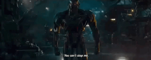 Man In Suit Talking In Dark Room GIF
