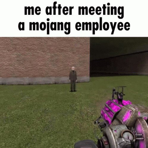 A Man In A Suit Is Standing In A Grassy Field In Front Of A Brick Building In A Video Game . GIF