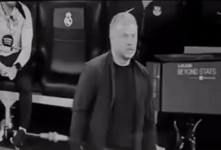 A Man In A Suit Is Standing In Front Of A Beyond Stats Sign . GIF