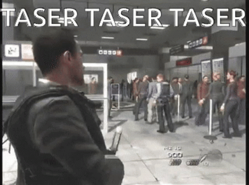 A Man In A Suit Is Standing In Front Of A Crowd In A Video Game With The Words Taser Taser Taser GIF