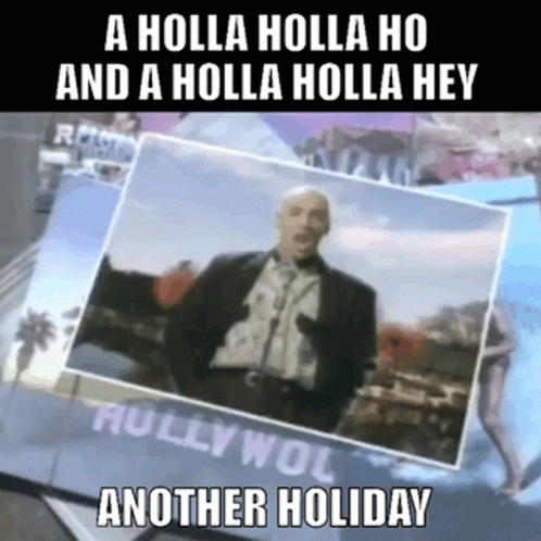 A Man In A Suit Is Standing In Front Of A Sign That Says A Holla Holla Ho And A Holla Holla Hey GIF