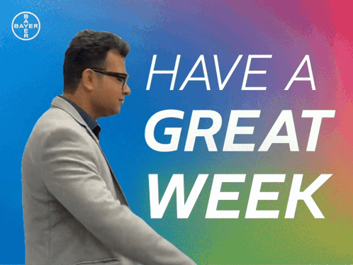 A Man In A Suit Is Standing In Front Of A Sign That Says " Have A Great Week " GIF