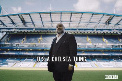 A Man In A Suit Is Standing In Front Of A Soccer Stadium And Says It 'S A Chelsea Thing GIF