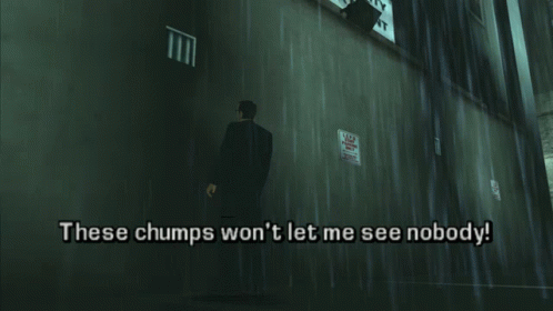 A Man In A Suit Is Standing In Front Of A Wall That Says These Chumps Won T Let Me See Nobody GIF