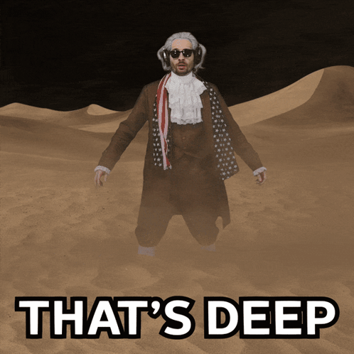A Man In A Suit Is Standing In The Sand With The Words That 'S Deep Written Below Him GIF
