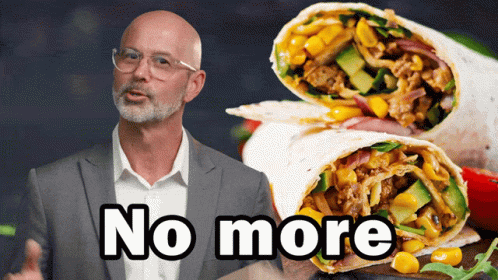 A Man In A Suit Is Standing Next To A Burrito That Says No More GIF