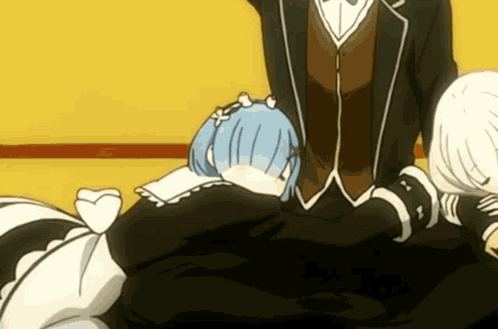 A Man In A Suit Is Standing Next To A Woman With Blue Hair GIF
