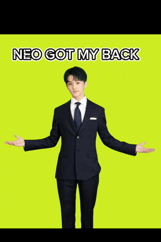 A Man In A Suit Is Standing With His Arms Outstretched And The Words Neo Got My Back Below Him GIF