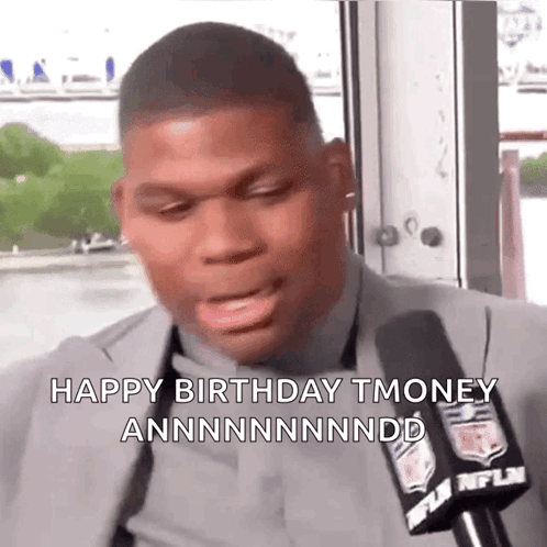 A Man In A Suit Is Talking Into A Microphone And Says Happy Birthday Tmoney GIF
