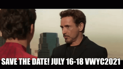 A Man In A Suit Is Talking To Another Man In A Red Shirt In Front Of A City . GIF
