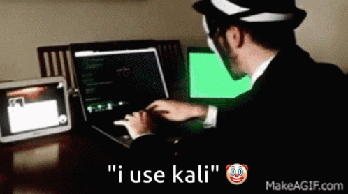 A Man In A Suit Is Typing On A Laptop With The Words " I Use Kali " Below Him GIF