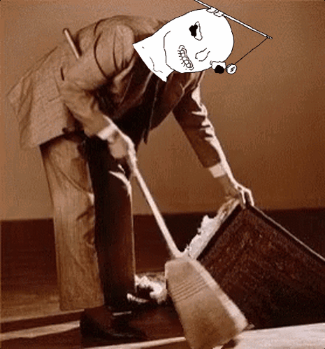A Man In A Suit Is Using A Broom To Clean A Floor GIF