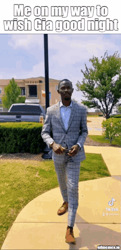A Man In A Suit Is Walking Down A Sidewalk With A Caption That Says Me On My Way To Wish Gia Good Night GIF