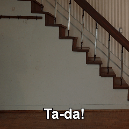 A Man In A Suit Is Walking Up A Set Of Stairs With The Words Ta-Da Written On The Bottom GIF