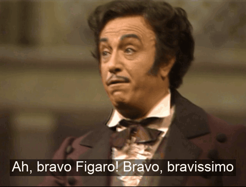 A Man In A Suit Says Ah Bravo Figaro Bravo Bravissimo GIF