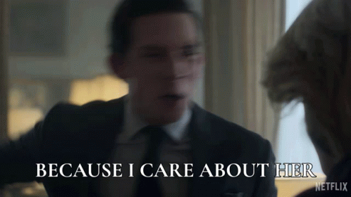 A Man In A Suit Says " Because I Care About Her " In Front Of A Woman GIF