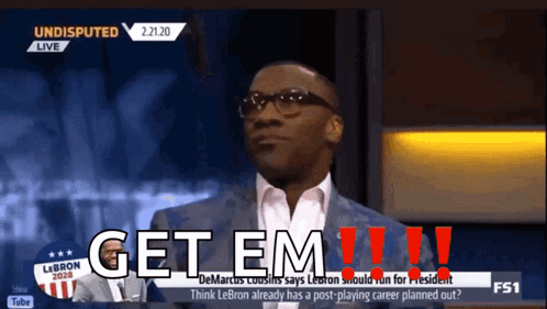 A Man In A Suit Says Get Em !!! GIF