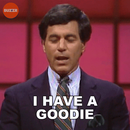 A Man In A Suit Says I Have A Goodie GIF