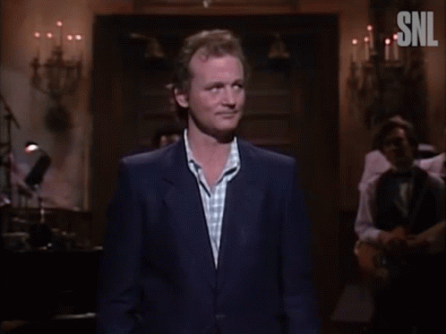 A Man In A Suit Says I 'M Frightened In Front Of A Crowd GIF