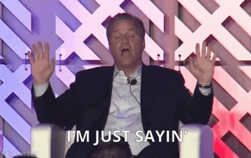 A Man In A Suit Says I 'M Just Sayin ' While Sitting In A Chair GIF