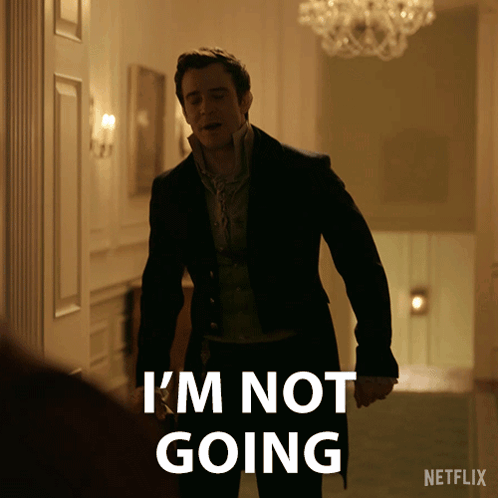 A Man In A Suit Says " I 'M Not Going " While Standing In A Hallway GIF
