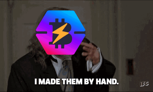 A Man In A Suit Says " I Made Them By Hand " In Front Of A Bitcoin Symbol GIF