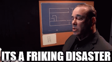 A Man In A Suit Says It 'S A Fricking Disaster In Front Of A Bulletin Board GIF