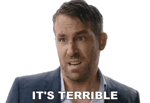 a man in a suit says it 's terrible in front of a white background