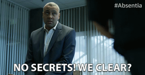 A Man In A Suit Says No Secrets We Clear In Front Of A Woman GIF