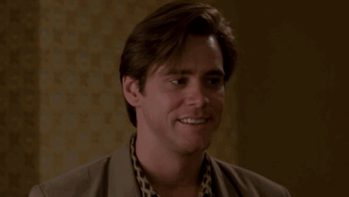 A Man In A Suit Says Nothing In A Room GIF