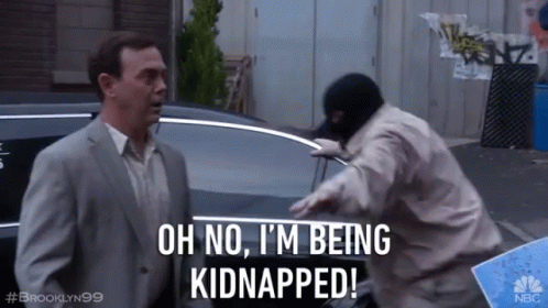 A Man In A Suit Says Oh No I 'M Being Kidnapped In Front Of A Man In A Mask GIF