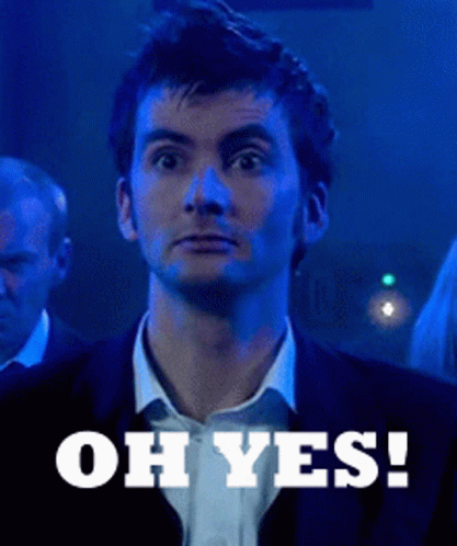 A Man In A Suit Says " Oh Yes " In Front Of Him GIF