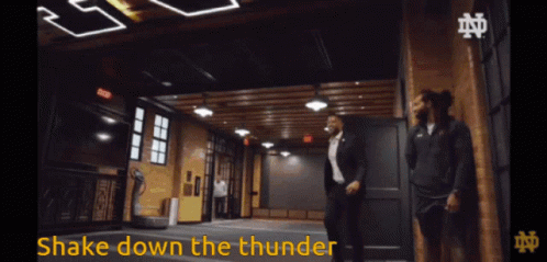 a man in a suit says shake down the thunder in a video