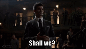 A Man In A Suit Says Shall We GIF
