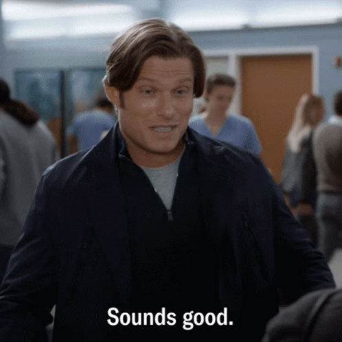 Man In Suit Saying Sounds Good In Crowd GIF