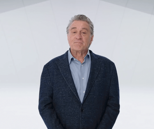 A Man In A Suit Says " Taaaa " In A Video GIF
