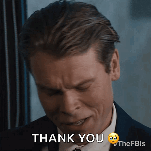A Man In A Suit Says Thank You With A Sad Face GIF