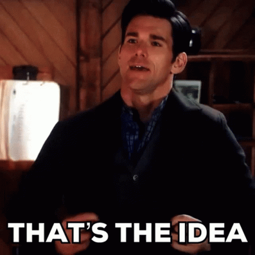 A Man In A Suit Says That 'S The Idea In Front Of A Wooden Wall GIF