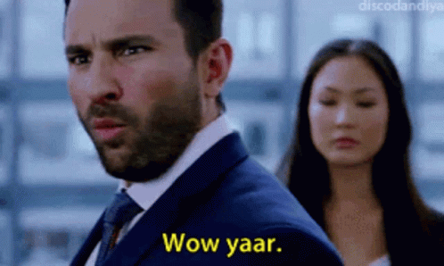 A Man In A Suit Says Wow Yaar While Standing Next To A Woman GIF