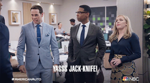 a man in a suit says yasss jack-knife in an office