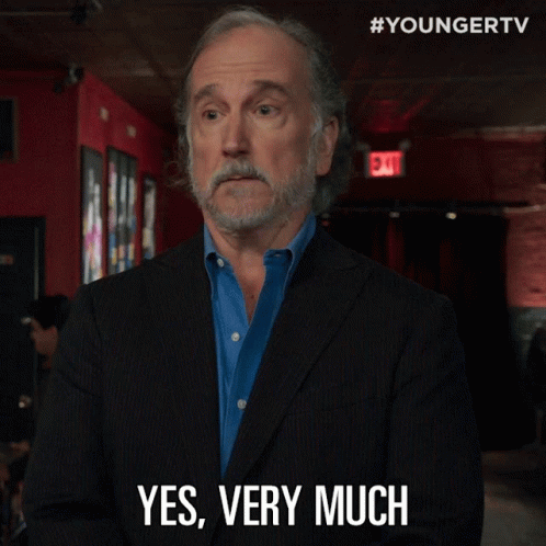 Man In Suit Says Yes Very Much GIF