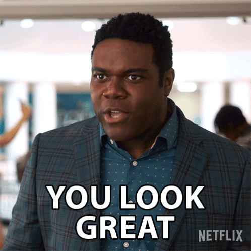 A Man In A Suit Says You Look Great In A Netflix Ad GIF