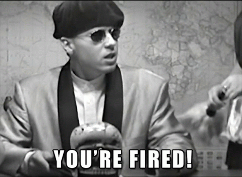 A Man In A Suit Says You 'Re Fired In A Black And White Photo GIF