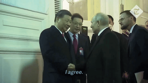 A Man In A Suit Shakes Hands With Another Man In A Suit And Tie With The Caption I Agree GIF