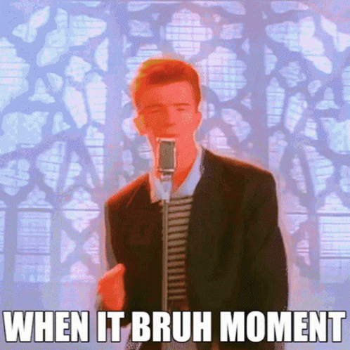 A Man In A Suit Singing Into A Microphone With The Words When It Bruh Moment Below Him GIF