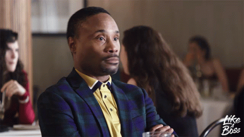 A Man In A Suit Sits At A Table With The Words Like A Boss Written On The Bottom GIF