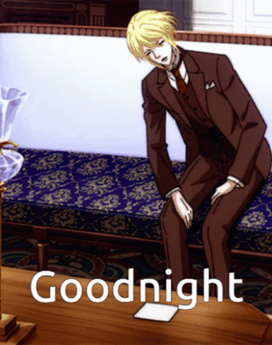 A Man In A Suit Sits On A Couch Next To A Table With The Words Goodnight Written On It GIF